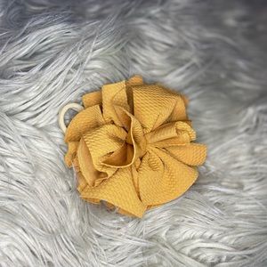 Handmade shredded bow on stretch headband/hair tye.